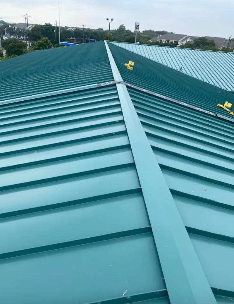 Green commercial metal roof ridge and valley for Metal Roof Repair in Lake Shore