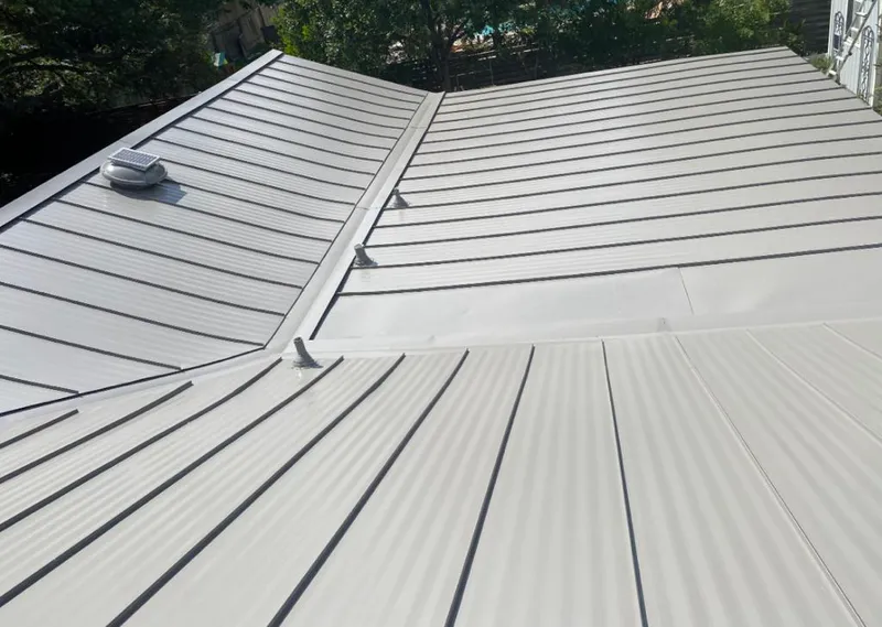 Solar attic fan installed on a metal roof for Roof Ventilation in Lake Shore
